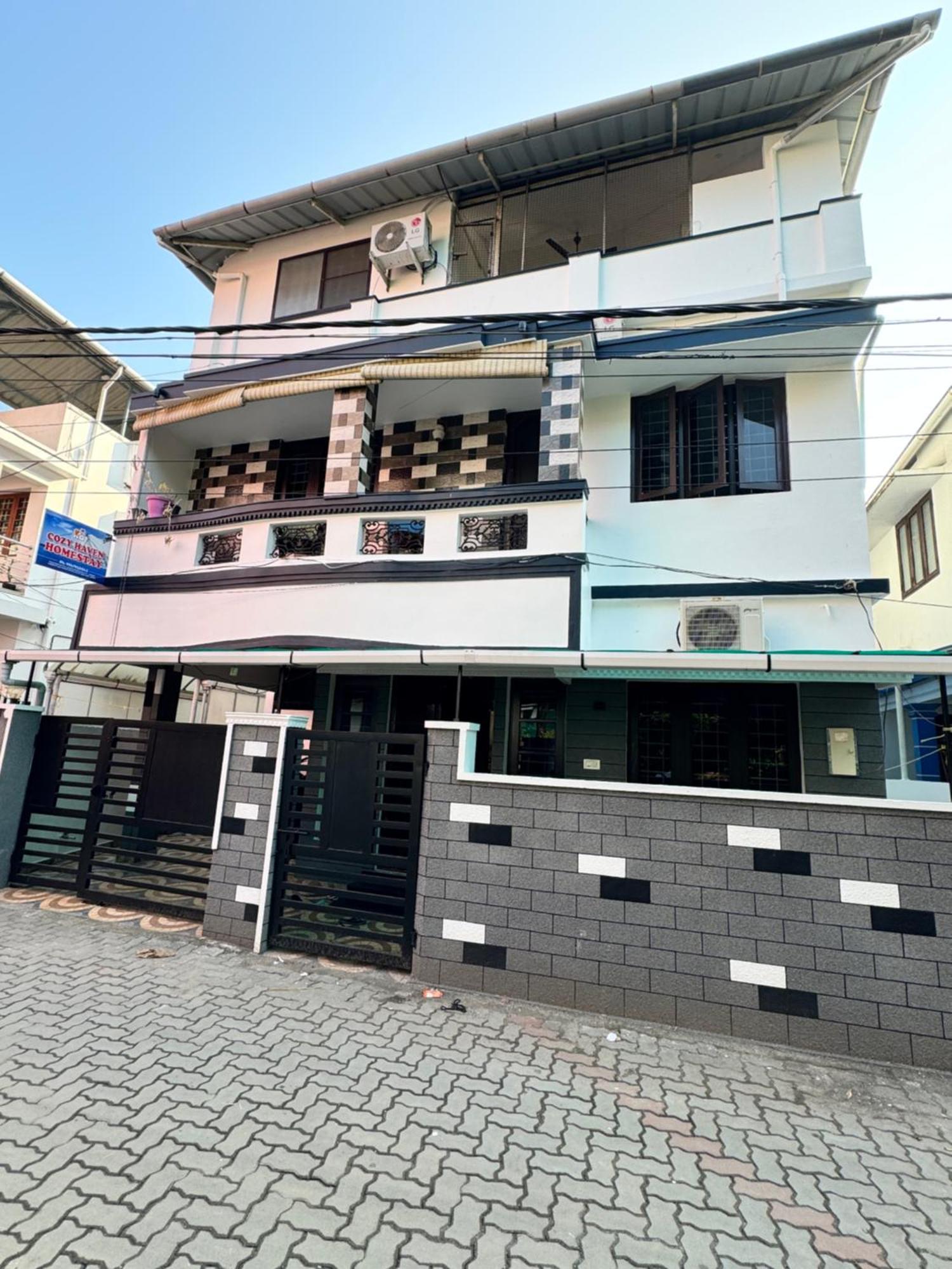 Cozy Haven Apartamento Kochi Exterior foto